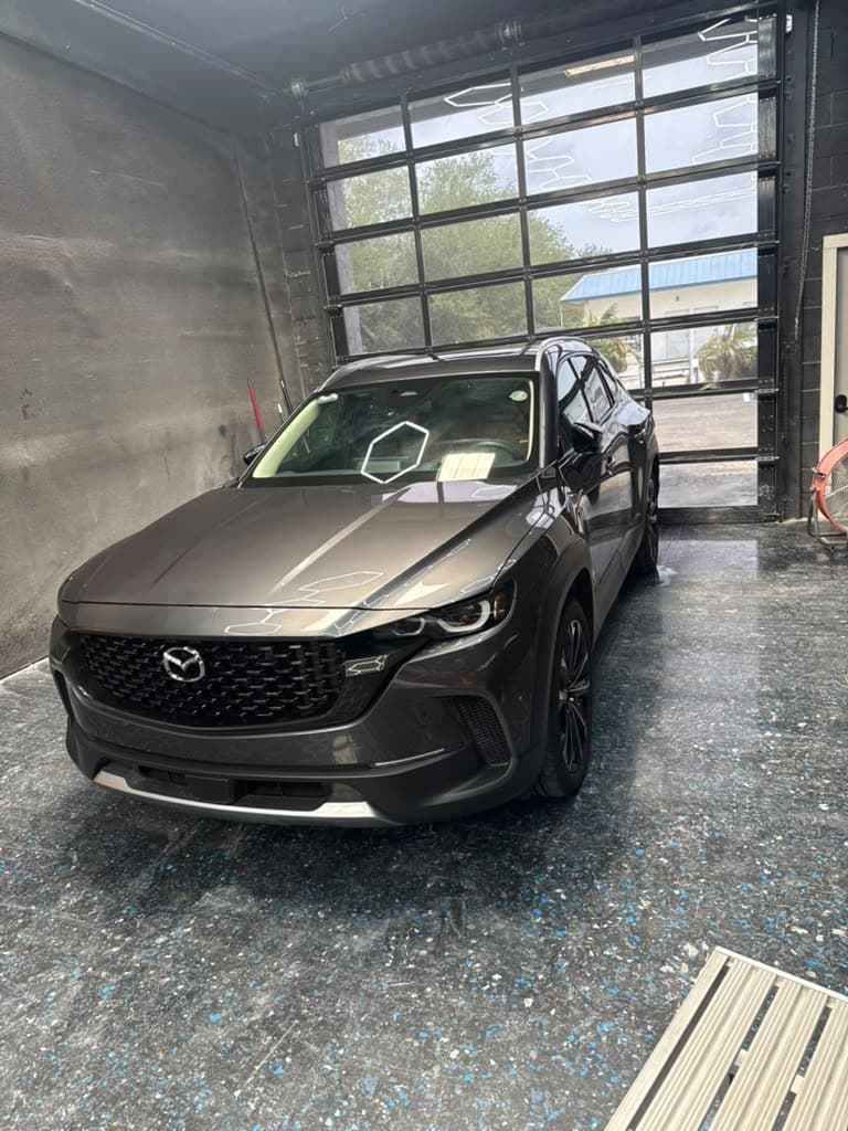 A Mazda CX-50 finished with Formula 1051 in the detail bay, panel reflections sharp and even